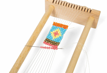 Wooden loom with colorful bead pattern. KID'S WOODEN BEAD WEAVING LOOM | BIGJIGS