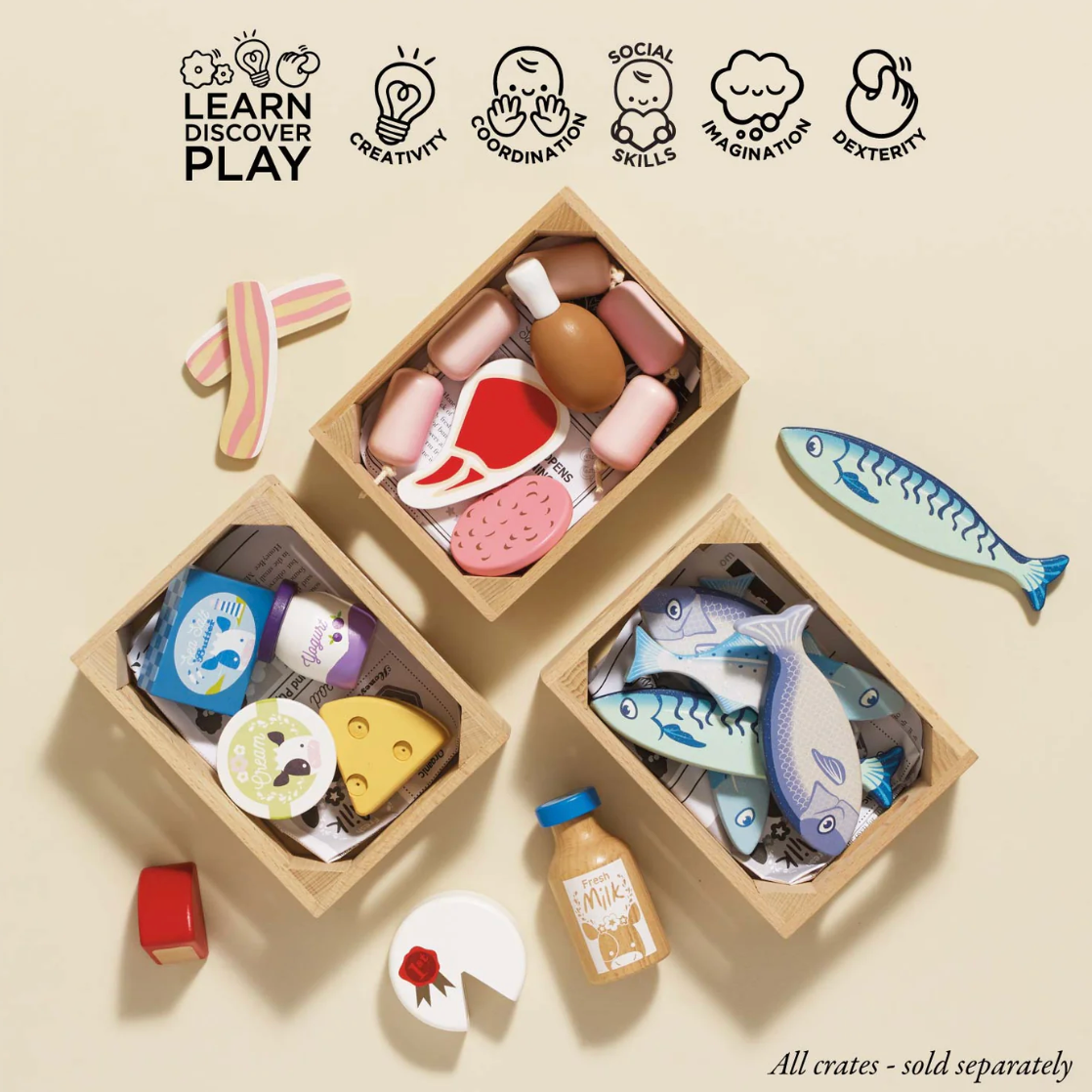 Set of wooden toys in crates with icons labeled 'Learn', 'Discover', 'Play' and various toy pieces on a beige background. MARKET FISH WOODEN TOY CRATE | LE TOY VAN