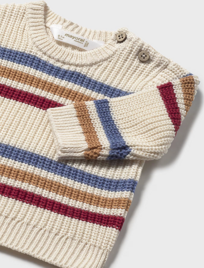 Mayoral Baby Boy Stripe Chunky Knit Cotton Jumper — close-up detail shot on light grey background; upper portion of the jumper shown from a slightly angled overhead perspective; chunky waffle-knit cotton texture of the cream/ecru fabric clearly visible in close detail; horizontal stripes in slate blue, warm tan/caramel and deep berry/burgundy running across the body and sleeves; ribbed crew neckline at the top; two small natural four-hole buttons on the left shoulder placket clearly visible; Mayoral size la
