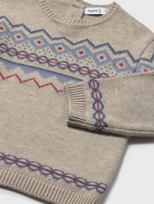Mayoral Children's Classic Jacquard Jumper in Oat — close-up detail shot on white background; angled overhead view of the upper body and left sleeve of the jumper; oat/chai heather marl knit fabric clearly visible; classic Fair Isle-style jacquard yoke pattern in periwinkle blue, red and cream shown in close detail across the chest and left sleeve; zigzag chevron band at the top of the yoke in periwinkle blue and cream; diamond motifs with red cross-stitch centres in the centre of the yoke; chain-link inter