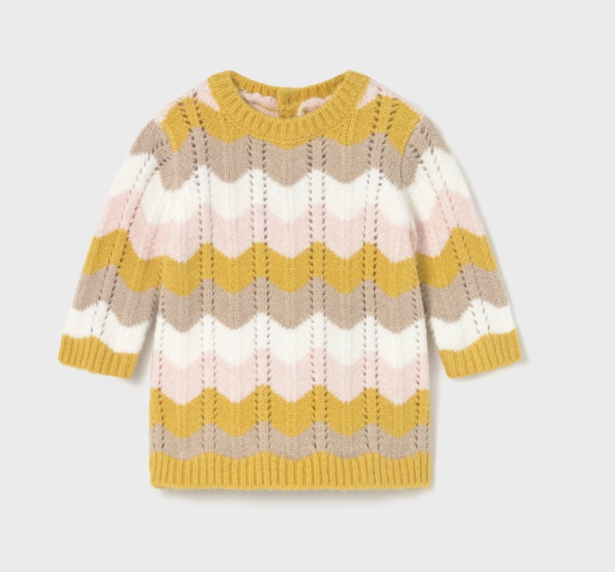 Mayoral Baby Girl Autumn Wave Knitted Dress — front ghost flat-lay on light grey background; full-length view of a baby knitted dress in an all-over chevron wave knit pattern in mustard yellow, pale pink, soft taupe and cream; ruffled crew neckline with mustard yellow ribbed trim; long sleeves with mustard yellow ribbed cuffs; mustard yellow ribbed hem band at the bottom; textured wave knit stitch visible throughout the body; light grey background; demonstrates the front silhouette, neckline detail and full