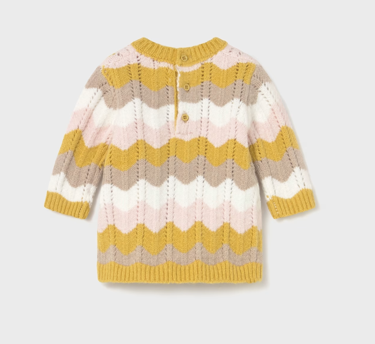 Mayoral Baby Girl Autumn Wave Knitted Dress — back ghost flat-lay on light grey background; full-length rear view of a baby knitted dress in an all-over chevron wave knit pattern in mustard yellow, pale pink, soft taupe and cream; ruffled crew neckline with mustard yellow ribbed trim visible at the top; two small mustard-toned buttons on the back placket at the neckline for easy dressing; long sleeves with mustard yellow ribbed cuffs; mustard yellow ribbed hem band at the bottom; textured wave knit stitch v