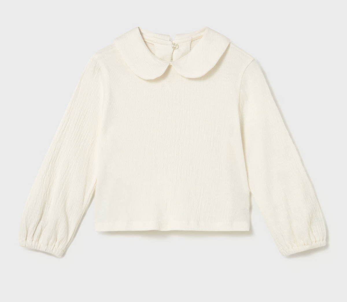 Cream blouse isolated — Peter Pan collar, balloon sleeves, elasticated cuffs.