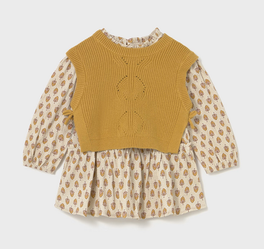 Front ghost flat-lay — vest over dress; ditsy floral posy print on sleeves and skirt; diamond eyelet panel; ruffle neckline and side tabs.