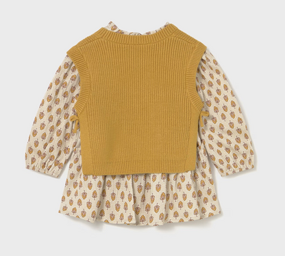 Back ghost flat-lay — plain ribbed knit back; small button at dress neckline; balloon sleeves and floral skirt. 