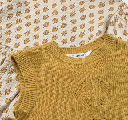 Close-up — floral posy print in detail; seed-stitch knit; diamond eyelet panel; Mayoral label.