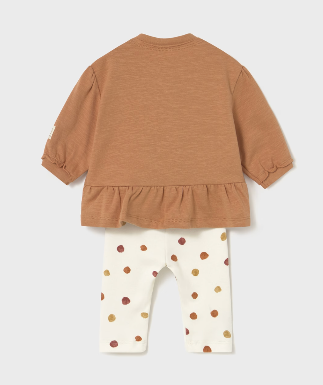 Back flat — plain peplum back; frill visible; gathered cuffs; polka dot leggings.