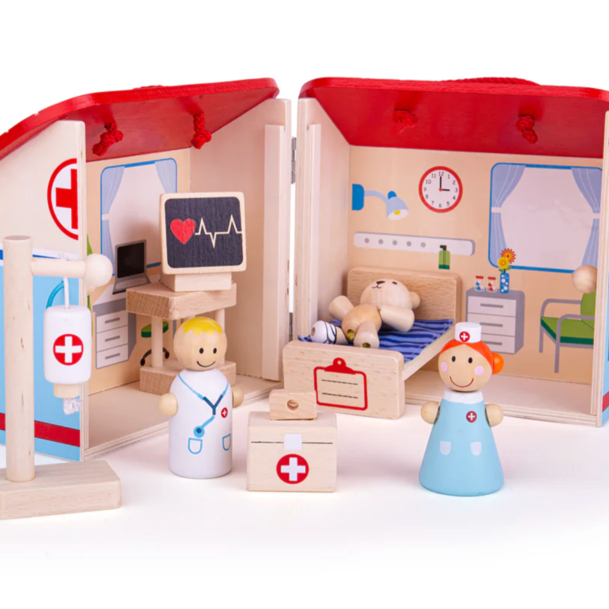 Wooden mini hospital playset with a red roof, white and blue accents, and includes a bed, medical drip, heart monitor, bear patient, nurse, and doctor figures. MINI WOODEN HOSPITAL PLAYSET | BIGJIGS