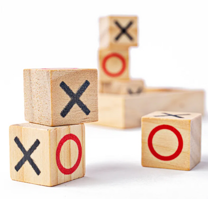 Wooden blocks with 'X' and 'O' symbols. MINI WOODEN NOUGHTS & CROSSES - TRAVEL SIZE | BIGJIGS