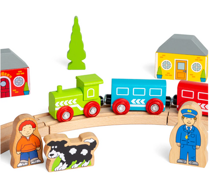 Wooden toy train set with colorful cars, houses, and figures on a white background MY FIRST TRAIN SET | BIGJIGS