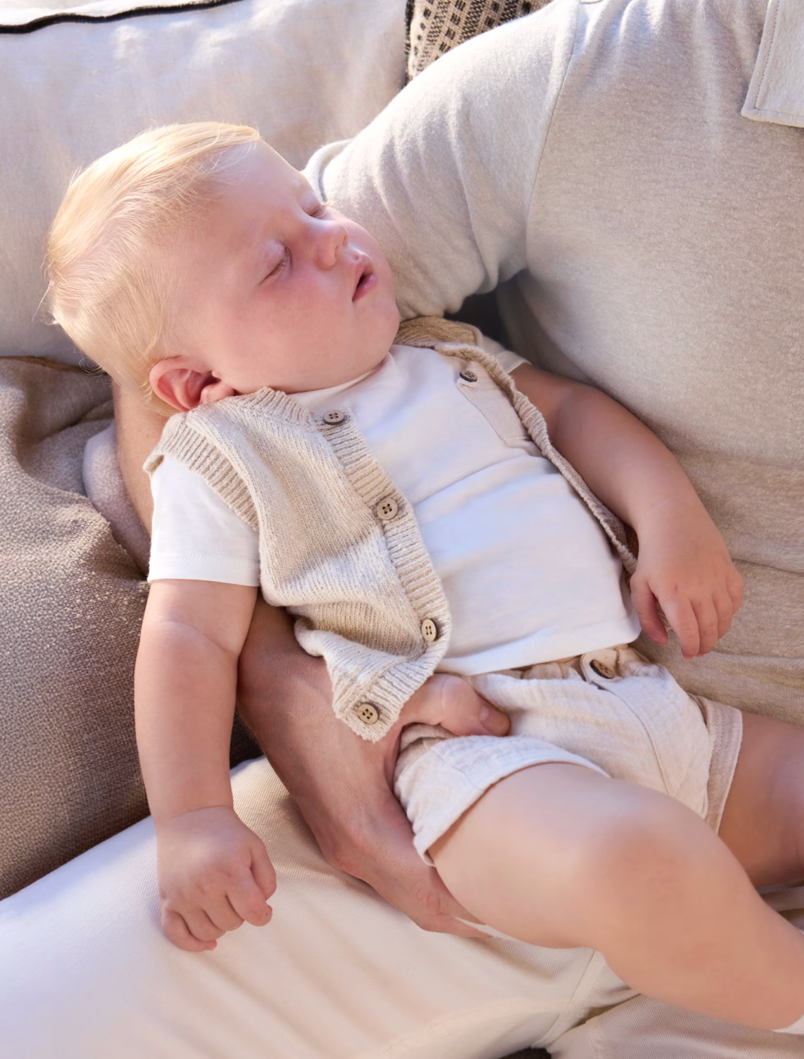 Baby in a light-colored outfit. NEUTRAL BABY SHORTS WITH VEST AND T-SHIRT SET | MAYORAL