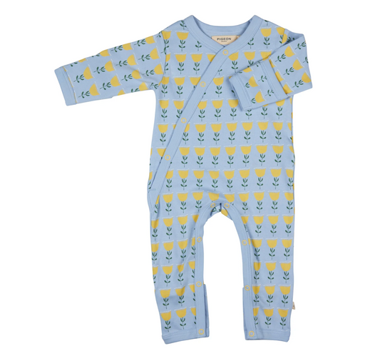Baby onesie with yellow floral pattern on a light blue background. ORGANIC COTTON BABY SLEEPSUIT - TULIP BABY BLUE | PIGEON ORGANICS