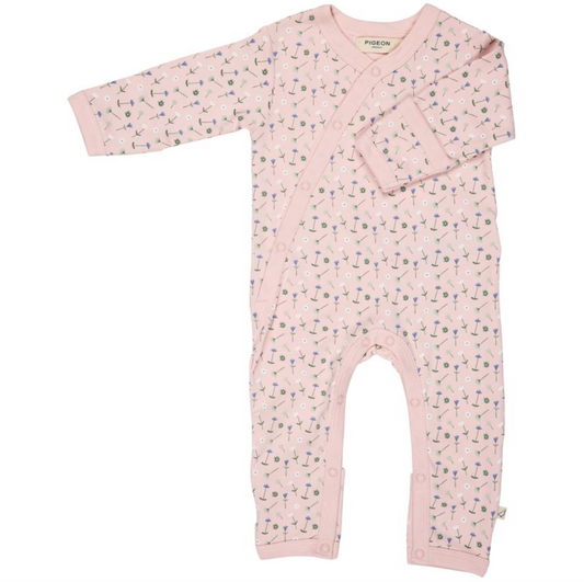 Pink Pigeon Organics baby onesie with a subtle flower pattern