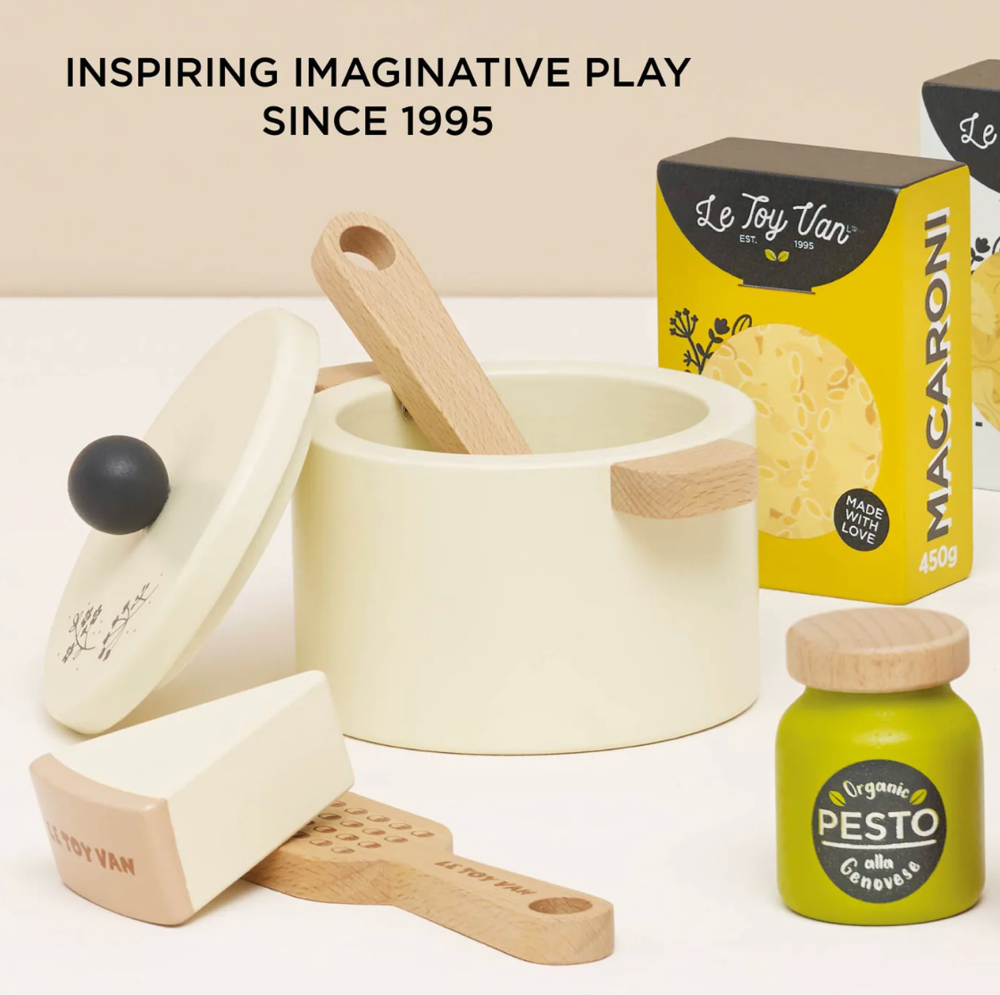 Children's play kitchen set with pots, pans, and a box of 'Le Toy Van' macaroni on a white background. ORGANIC PASTA SET | LE TOY VAN