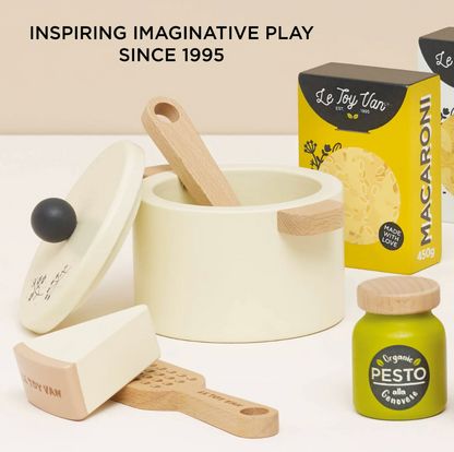 Children's play kitchen set with pots, pans, and a box of 'Le Toy Van' macaroni on a white background. ORGANIC PASTA SET | LE TOY VAN