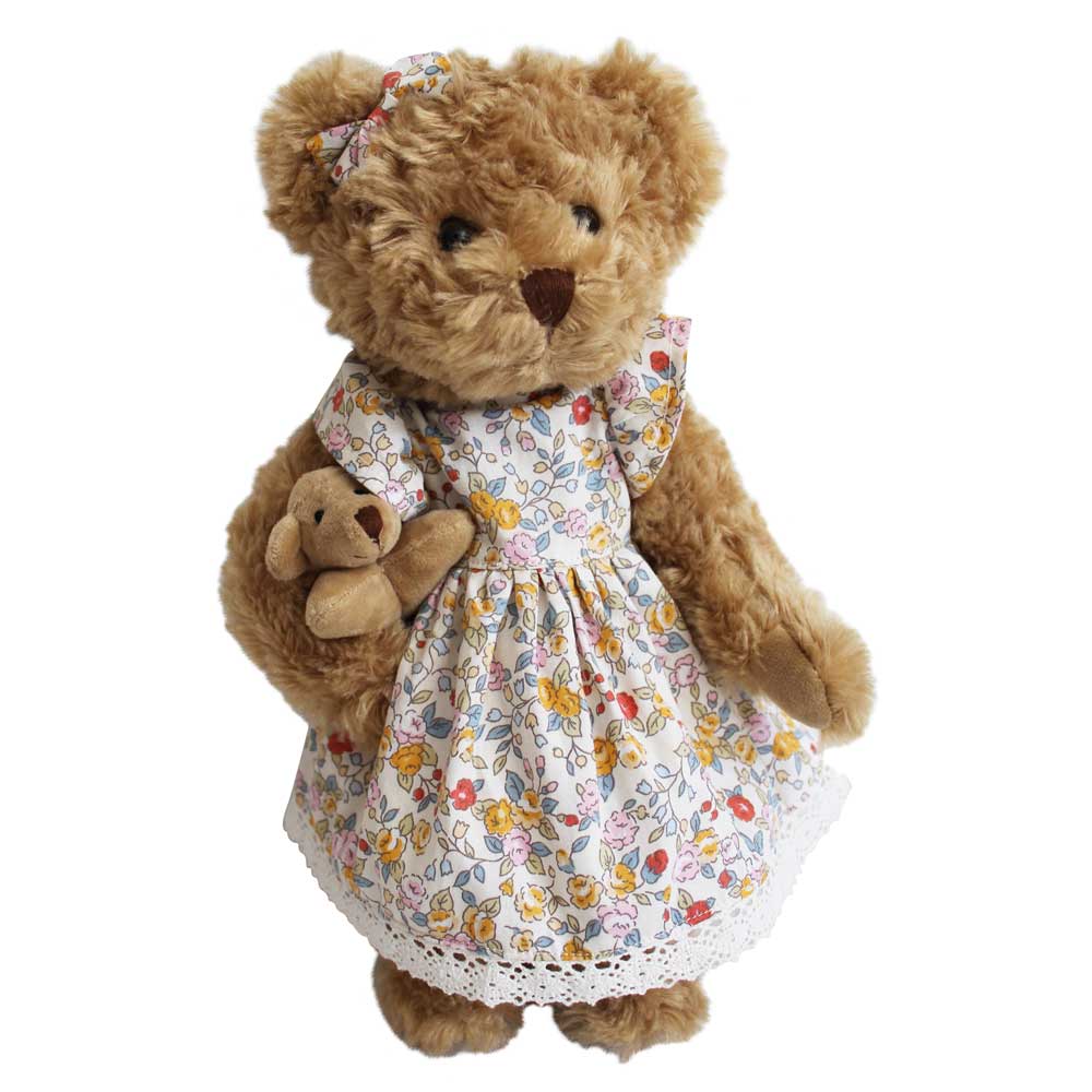 A plush toy bear wearing a floral dress and holding a smaller plush bear, with both bears having a shaggy texture and decorative details such as a bow on the ear and crochet lace on the hem. PINK & YELLOW FLORAL DRESS TEDDY & BABY BEAR | POWELL CRAFT