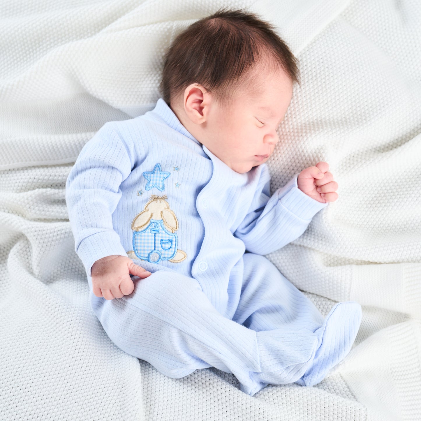 Three premature baby sleepuits in white, pink, and blue colors, with front and crotch poppers. PREMATURE BABY RABBIT & STAR SLEEPSUIT - BABY BLUE | DANDELION