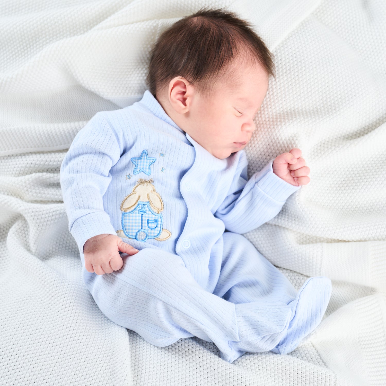 Three premature baby sleepuits in white, pink, and blue colors, with front and crotch poppers. PREMATURE BABY RABBIT & STAR SLEEPSUIT - BABY BLUE | DANDELION