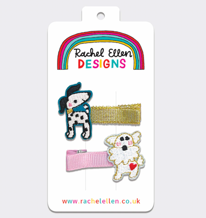Three hair clips on a 'Rachel Ellen Designs' card with a rainbow and website URL. RACHEL ELLEN HAIR CLIPS - DOGS