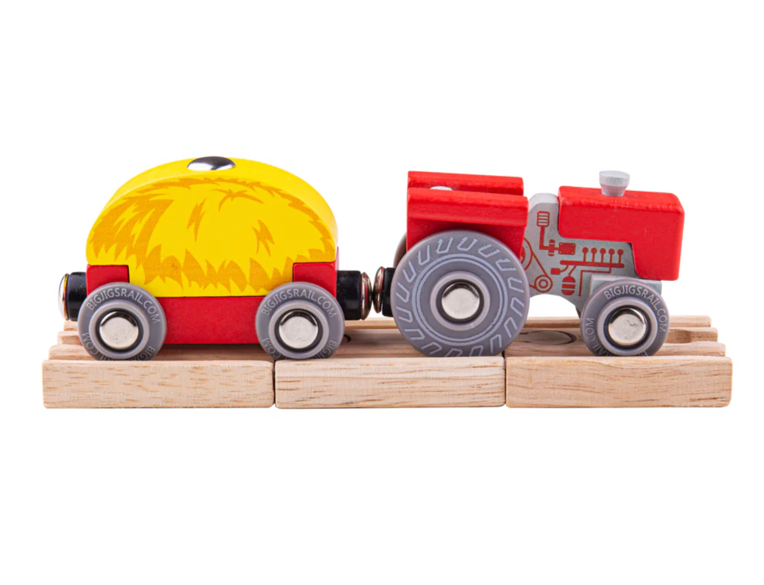 Toy tractor with a red cabin and yellow trailer. RED TRACTOR & WAGON WOODEN TRAIN | BIGJIGS RAIL