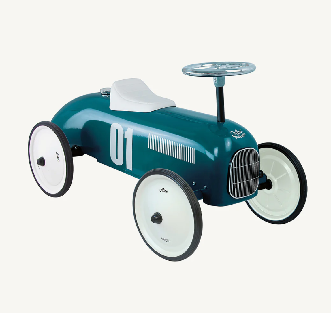 Vintage-style toy car with a steering wheel. RIDE ON CLASSIC CAR - PETROL BLUE WITH WHITE SEAT AND WHEELS | VILAC