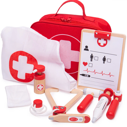 A children's wooden doctor's kit including a stethoscope, thermometer, syringe, clipboard with paper, apron, bandage, and a carry bag with a handle. ROLE-PLAY WOODEN DOCTOR'S KIT | BIGJIGS