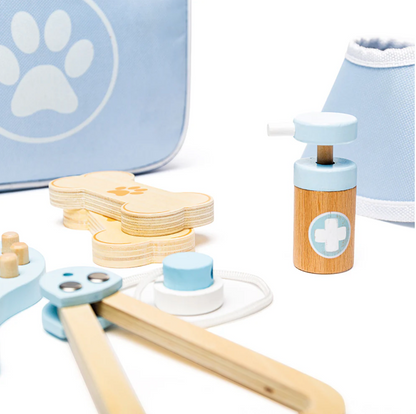 Wooden toy medical set with a blue and white paw print bag in the background ROLE-PLAY WOODEN VETERINARY SET | BIGJIGS