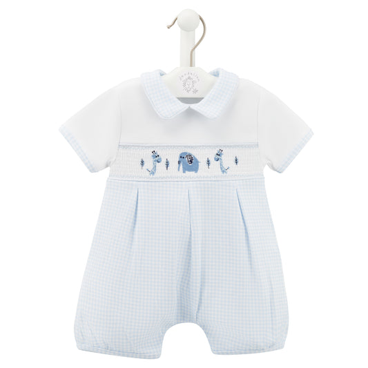 Baby romper with blue and white design on a hanger against a white background. SMOCKED JUNGLE FRIENDS COTTON BABY ROMPER WITH PETER PAN COLLAR | DANDELION 