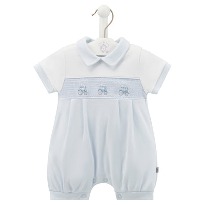 A pink short-sleeved romper with a Peter Pan collar and a smocked tractor design on the chest, displayed on a hanger. SMOCKED TRACTOR COTTON SUMMER ROMPER OUTFIT - BABY BLUE | DANDELION
