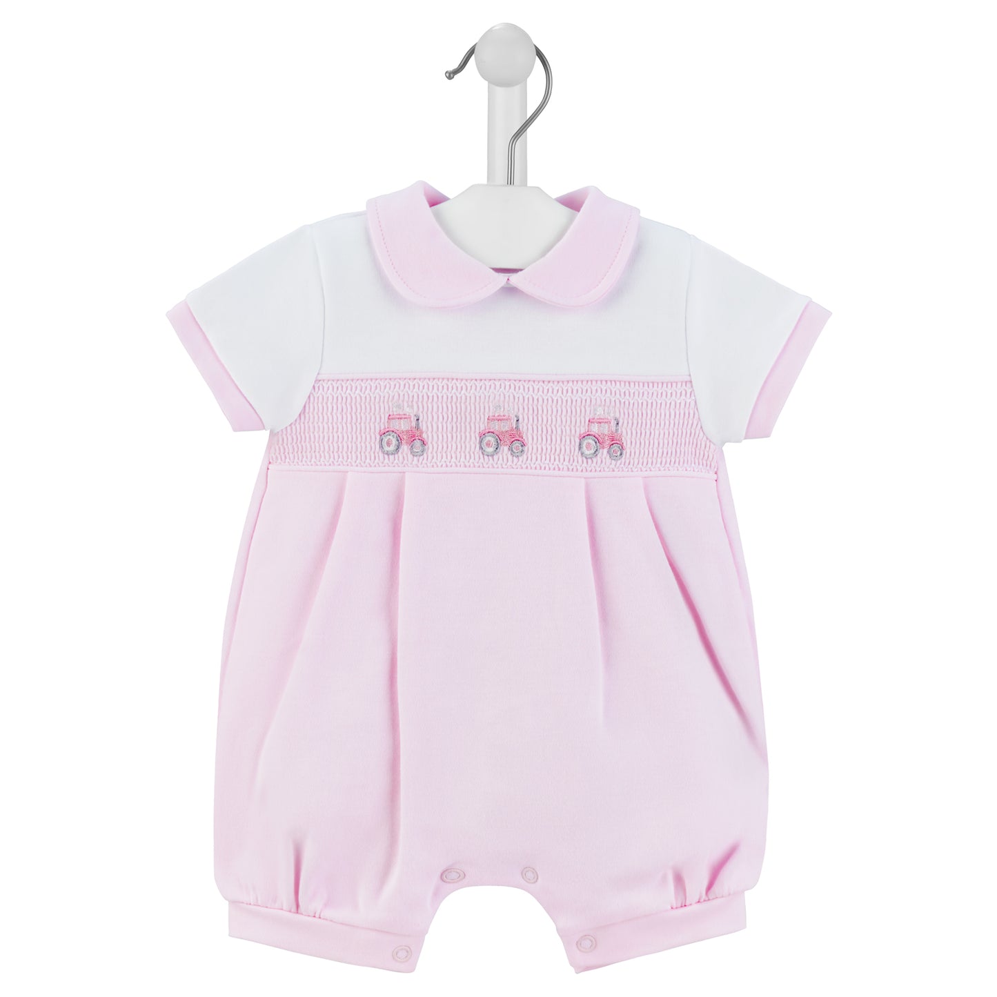 A pink short-sleeved romper with a Peter Pan collar and a smocked tractor design on the chest, displayed on a hanger. SMOCKED TRACTOR COTTON SUMMER ROMPER OUTFIT - BABY PINK | DANDELION