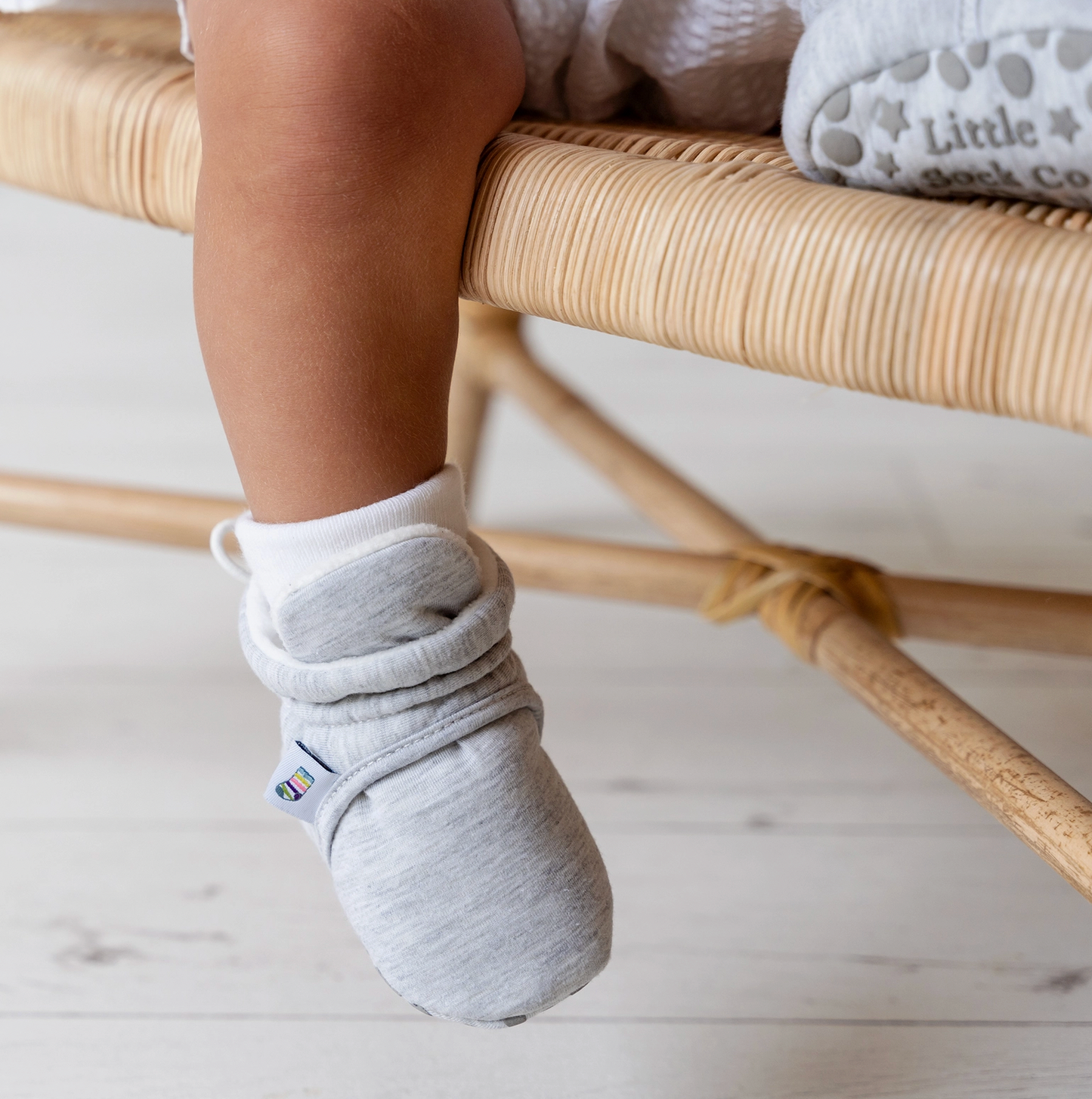 Baby's foot wearing a gray sock with a white background STAY-ON, NON-SLIP BOOTIE - GREY | THE LITTLE SOCK CO.