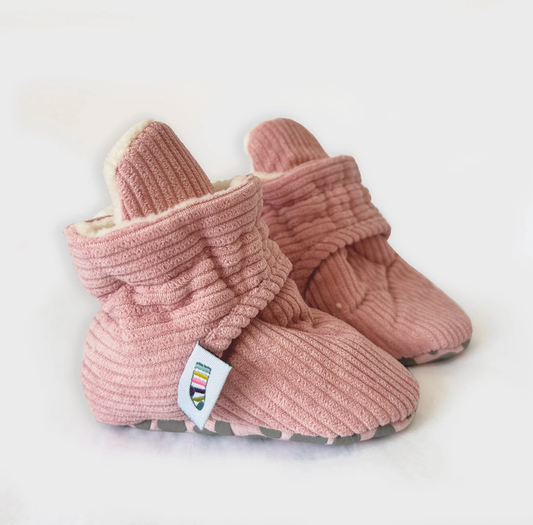 Pair of pink baby booties on a white background STAY-ON, NON-SLIP BOOTIE - PINK CORDUROY | THE LITTLE SOCK CO.