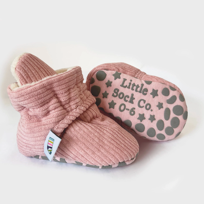 Pink baby booties with 'Little Sock Co.' branding on a white background STAY-ON, NON-SLIP BOOTIE - PINK CORDUROY | THE LITTLE SOCK CO.