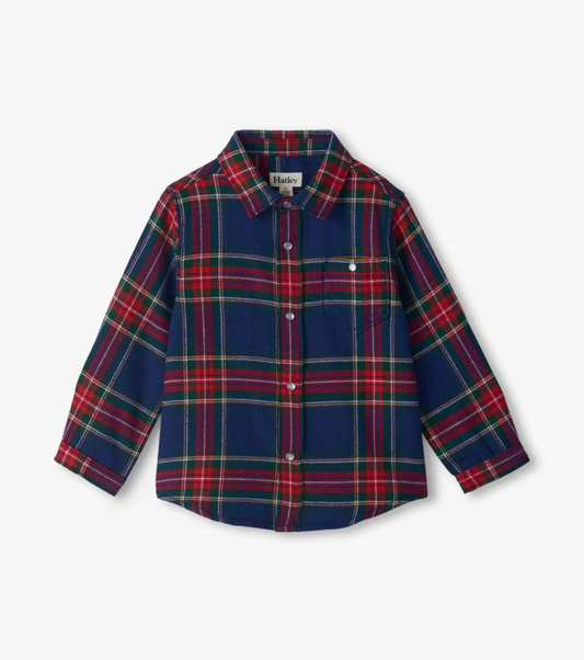 Hatley boys holiday plaid button-down shirt in navy, red and green tartan with snap fastenings and chest pocket, flat lay on white background