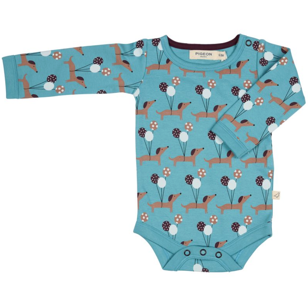A long-sleeve baby bodysuit by Pigeon in a dusty blue color, featuring an all-over print of dachshunds, flowers, and berries. The bodysuit has three snap buttons at the crotch and is displayed flat against a white background.