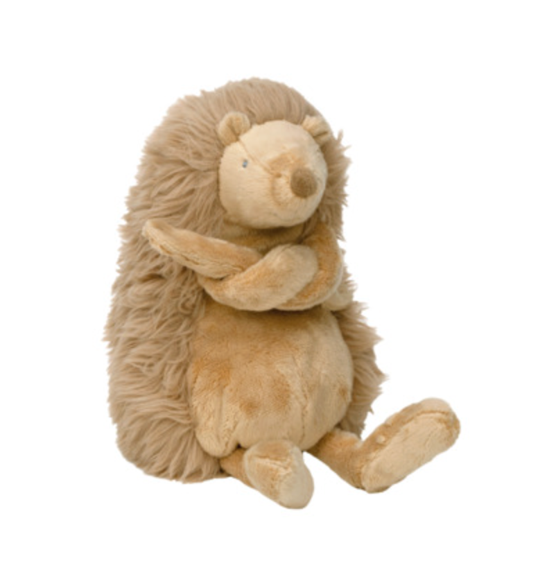 A plush stuffed hedgehog toy in soft tan and light brown tones, photographed against a plain white background.