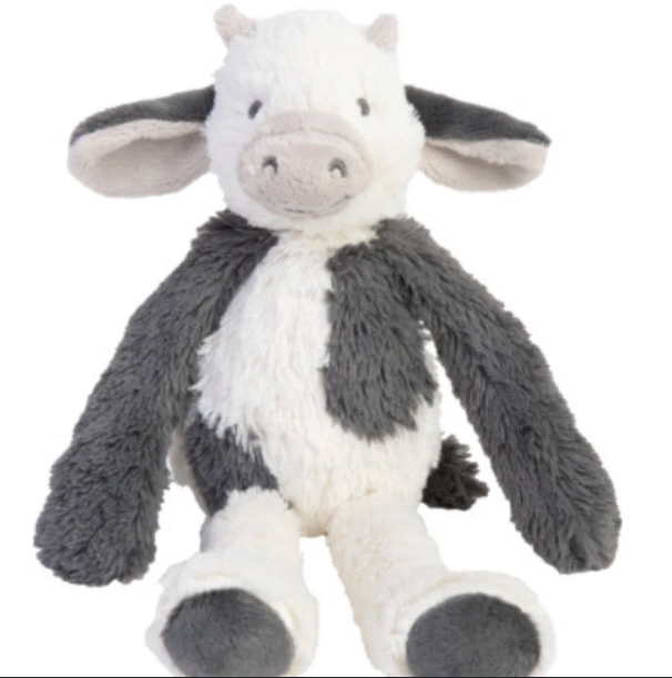 A plush stuffed cow toy with a white body, dark gray patches, floppy ears, and a soft snout, photographed on a plain white background.