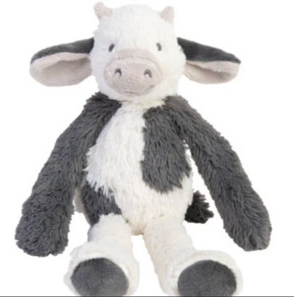 A plush stuffed cow toy with a white body, dark gray patches, floppy ears, and a soft snout, photographed on a plain white background.
