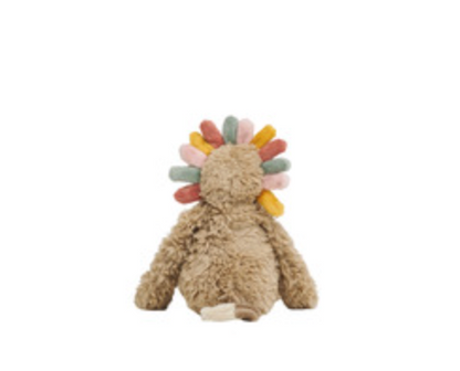 A plush stuffed toy shaped like a seated figure with a fluffy beige body and a fan of soft pastel feathers in yellow, orange, green, pink, and blue behind its head, shown on a plain white background.