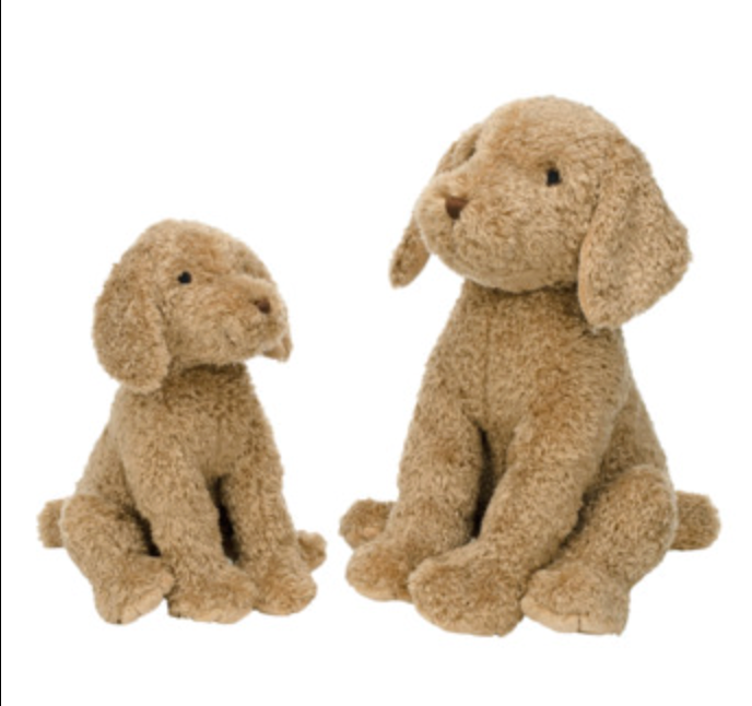 Two plush puppy toys in light tan bouclé fabric, one small sitting puppy and one larger sitting puppy, photographed on a plain white background.