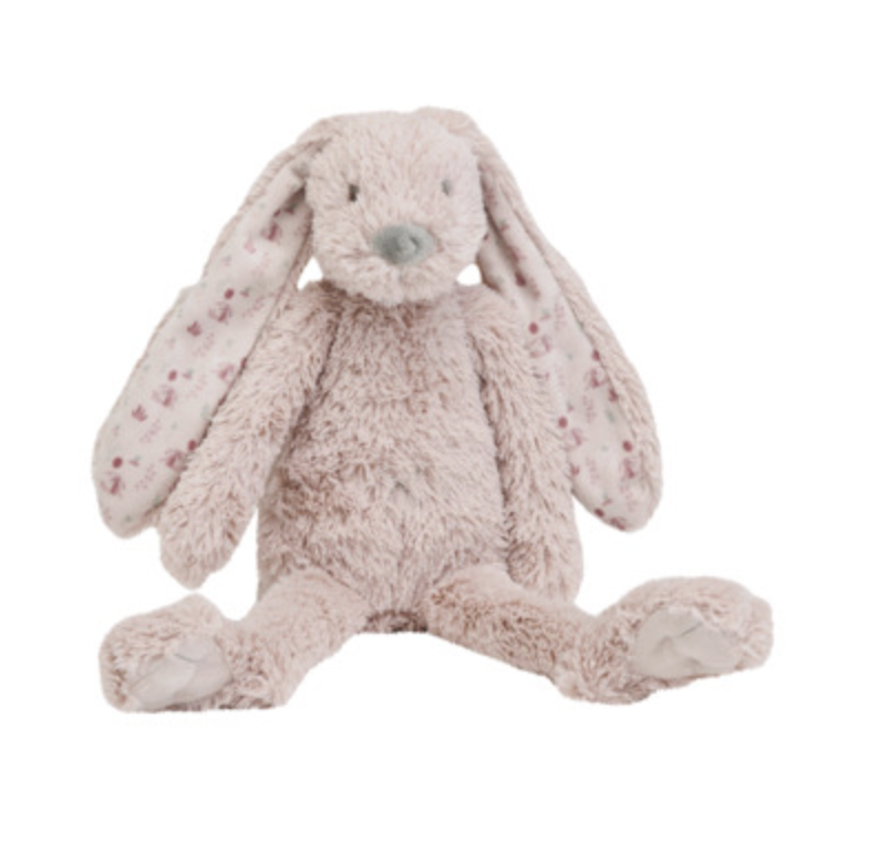 A plush stuffed bunny toy in a pale blush pink color, featuring long floppy ears with small darker pink spots, a grayish nose, and sitting with its legs extended against a plain white background.