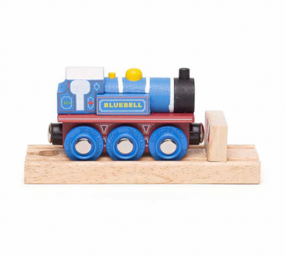 A wooden toy train engine named 'BLUEBELL' in blue, red, and black, mounted on a light-colored wooden track and block against a white background.