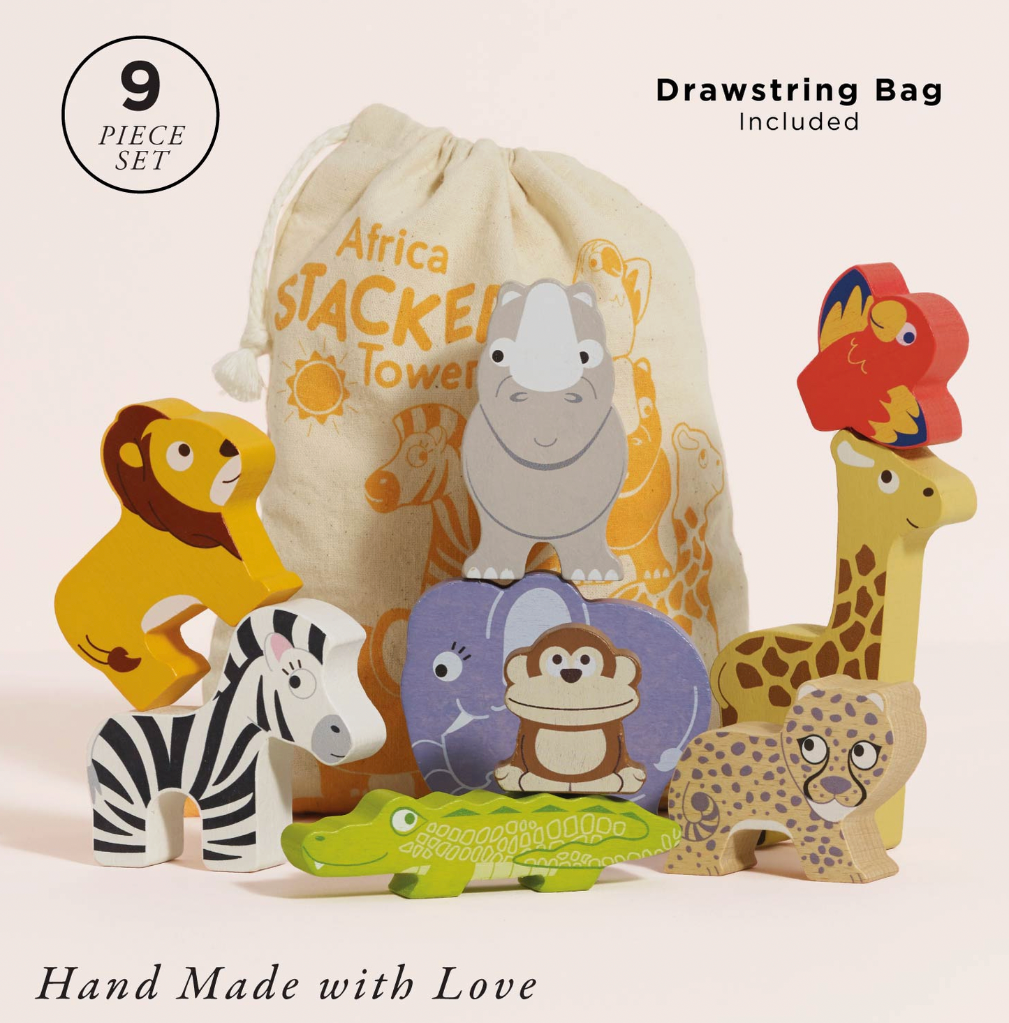 A 9-piece wooden toy set featuring safari animals and a drawstring bag. The set includes a lion, zebra, giraffe, crocodile, leopard, monkey, and a bird, with a cream-colored drawstring bag printed with cartoon animals and the text 'Africa Stackers Tower'.