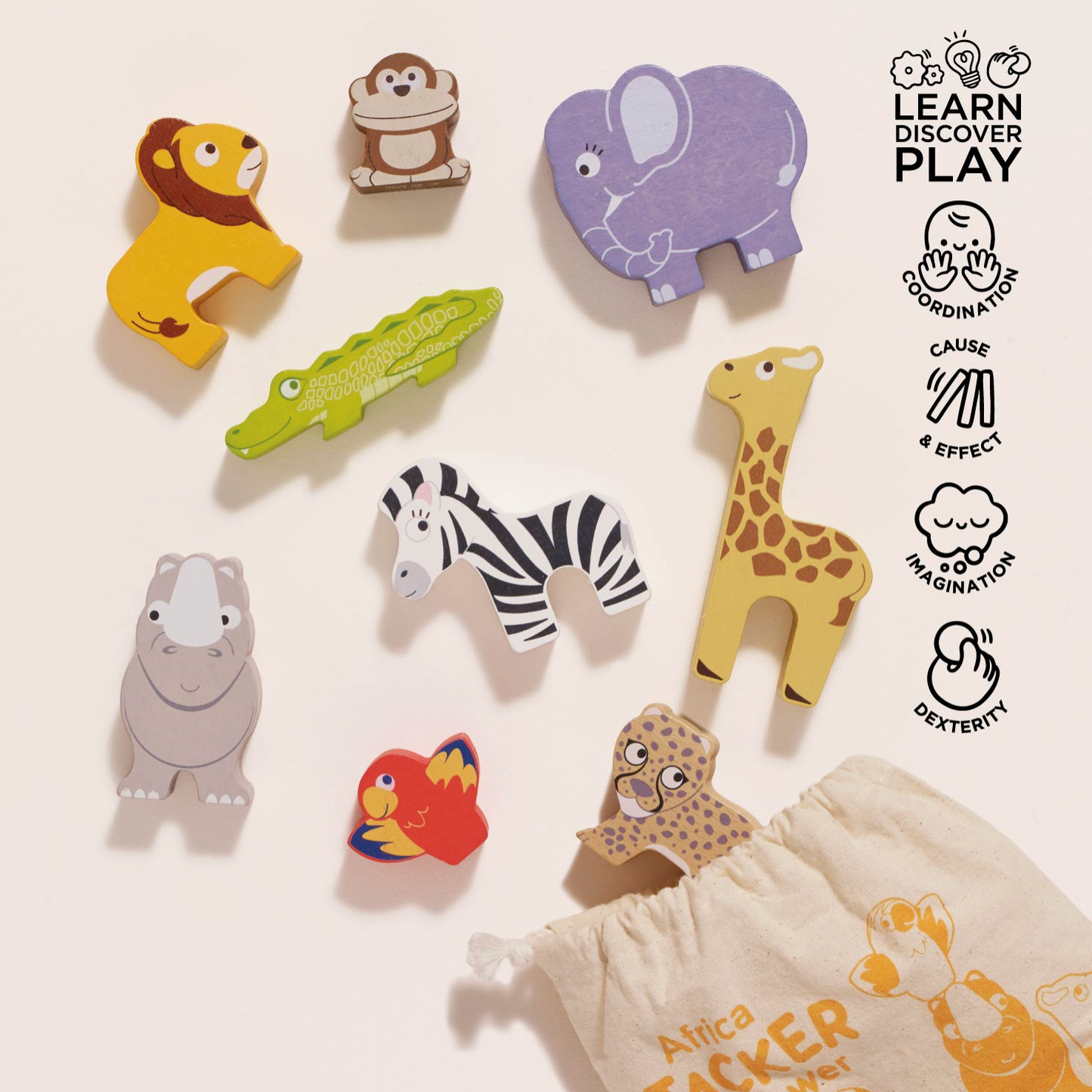 A set of colorful wooden animal puzzle pieces for Africa-themed learning, including a lion, elephant, crocodile, zebra, giraffe, hippo, parrot, leopard, and a drawstring bag, arranged on a light beige background with a 'LEARN DISCOVER PLAY' logo on the right.