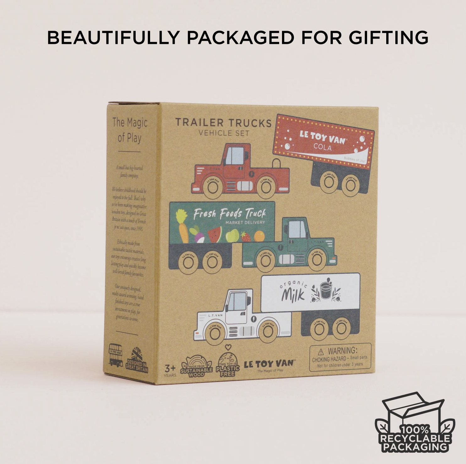 LE Toy Van Colab Trailer Trucks Vehicle Set in its original kraft paper packaging, displayed on a clean white background with promotional text at the top and a recycling logo at the bottom right.