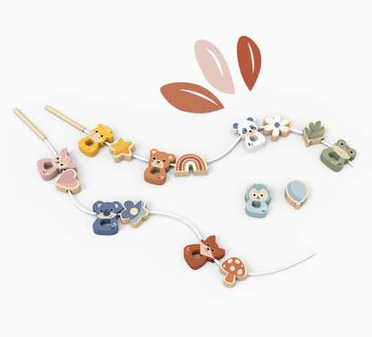 A wooden bead garland with various animal and nature-themed wooden beads, displayed on a clean white background with a few abstract leaf graphics above.
