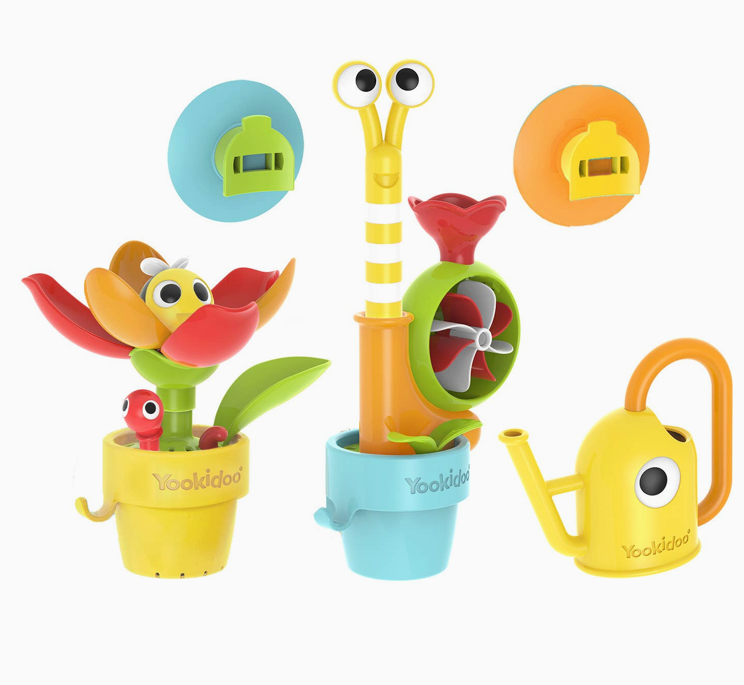 A colorful children's toy set on a white background, featuring a flower pot with a smiling flower and bird, a tall striped watering can with a green fan, and a yellow watering can with a face. Two circular suction-cup pieces are shown above.