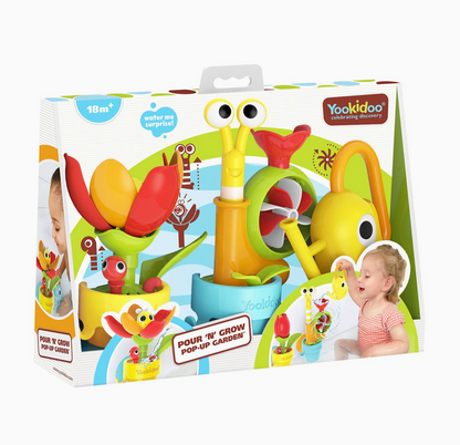 Yackidoo Pour 'N' Grow Pop-Up Garden toy set in its retail packaging, featuring a colorful design with a yellow snail watering can, red and yellow flower, and green leaf.