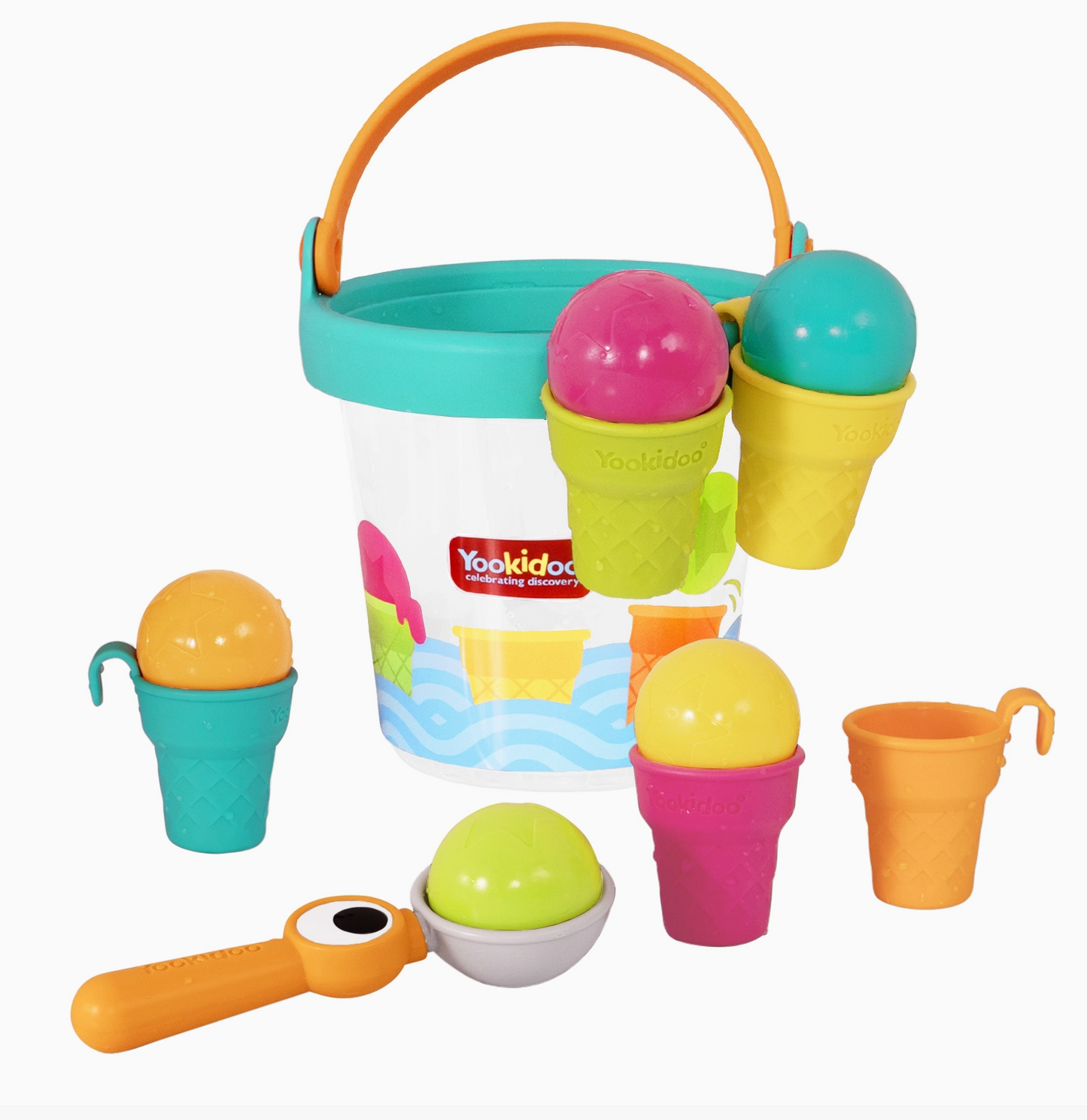 A Yookidoo children's ice cream and beach bucket play set on a white background, featuring a white bucket with a turquoise rim and handle, colorful plastic ice cream cones, a scoop, cups, and a small shovel.
