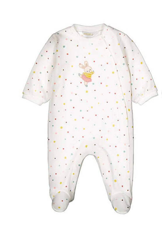 A white footed baby jumpsuit with a multicolor polka dot pattern and a small bunny graphic on the chest, shown against a plain white background.